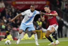 Man United vs Crystal Palace: Jordan Ayew of Crystal Palace holds off Diogo Dalot of Manchester United during the Carabao Cup match